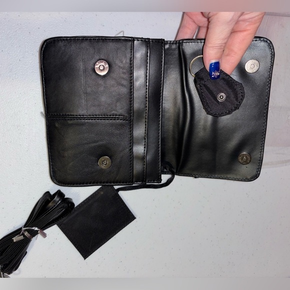 Sleek Black Messenger Bag with Adjustable Strap and Durable Material - Picture 9 of 9